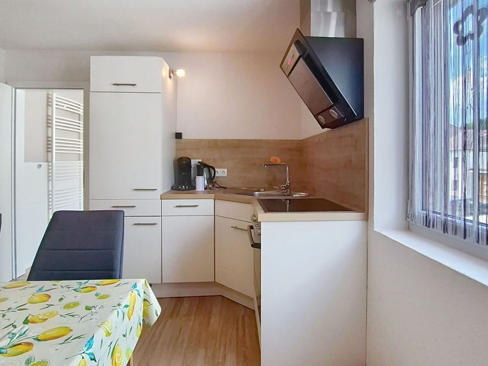 Interior Design, Wood, Furniture, Flooring, Floor, Kitchen, Countertop, Ceiling, Major Appliance, Room