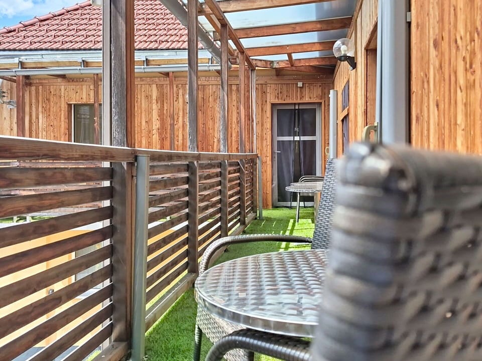 Wood, Wood Stain, Hardwood, Deck, Plank, Outdoor Furniture, Porch, Chair, Outdoor Structure, Lumber