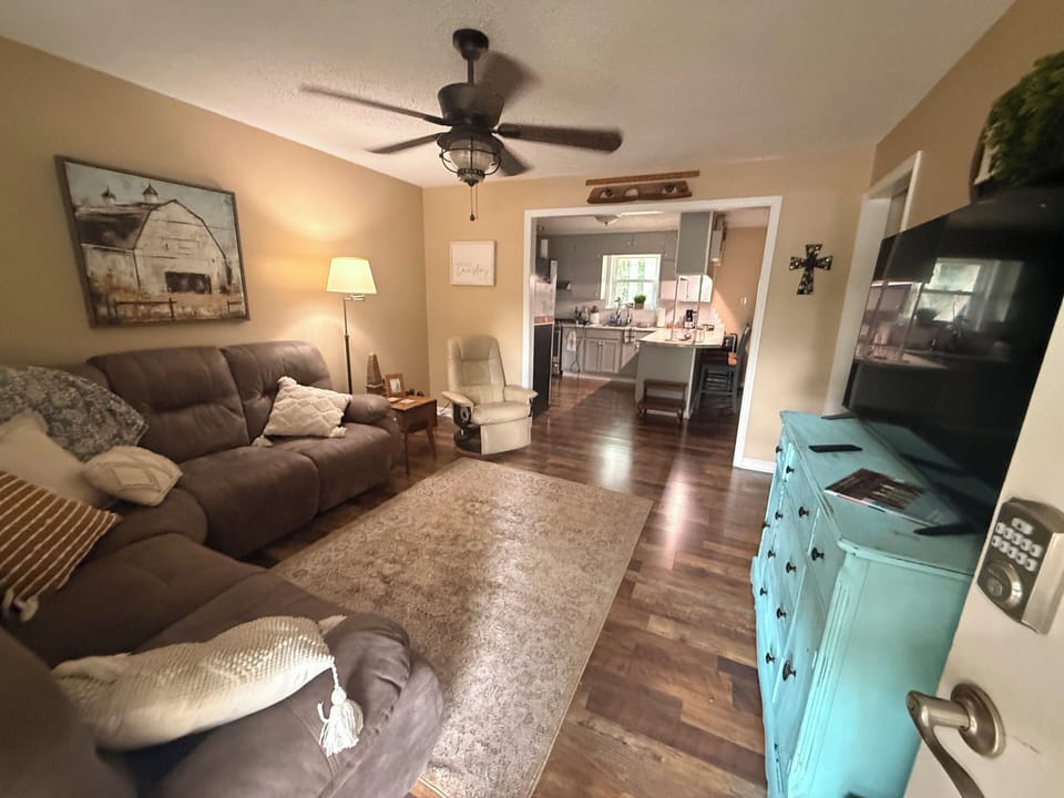 Relaxing den with power sectional and another recliner