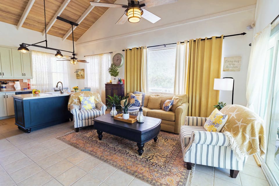Vaulted wood ceilings with plantation shutters and cozy seating