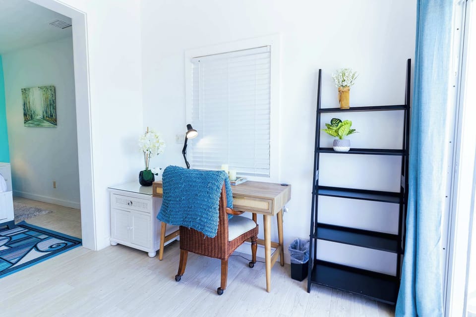 Desk nook off the hallway with shelving