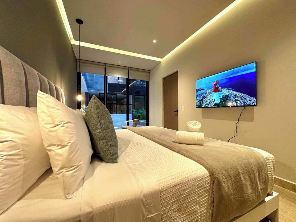 King bedroom with AC, TV and direct garden access