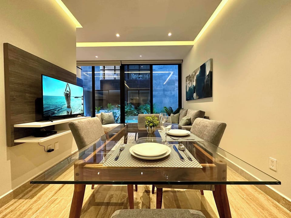 Dining area for 4 with kitchen and garden views