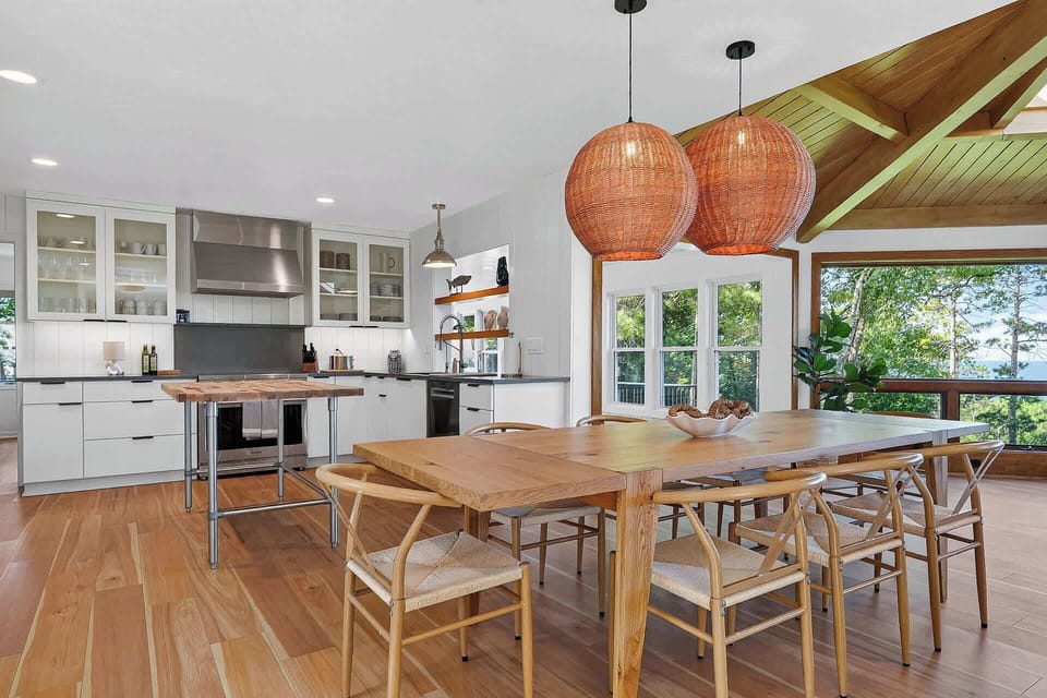 Dining table with seating for 8 flows into open concept kitchen