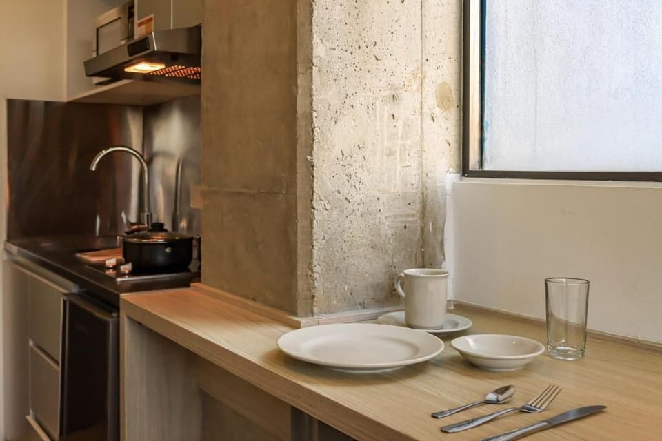 Mini-fridge, microwave, stovetop, cookware/dishes/utensils