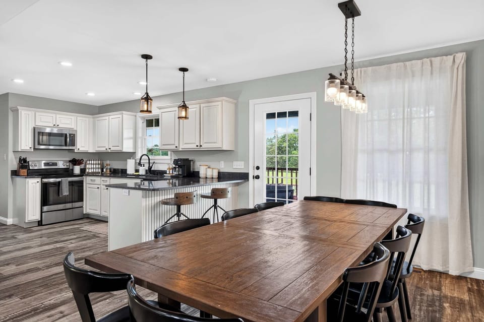 Dining Area: A warm and inviting dining area provides the perfect spot to sit down, share a meal, and spend quality time together throughout your stay.