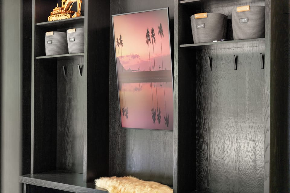 Modern spa-style bathroom with double vanity and illuminated mirror