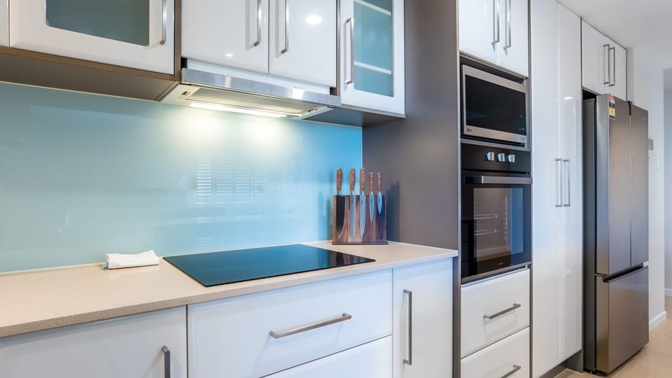 Modern kitchen with generous storage and built-in appliances.