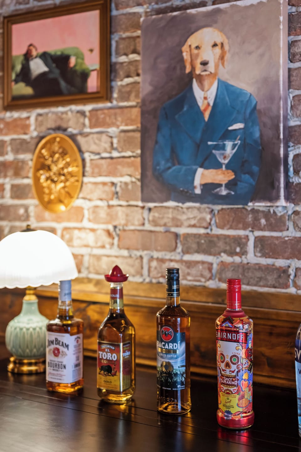 Sir Golden Retriever, martini in paw, oversees the bar. The gallery wall is full of characters , come meet them.