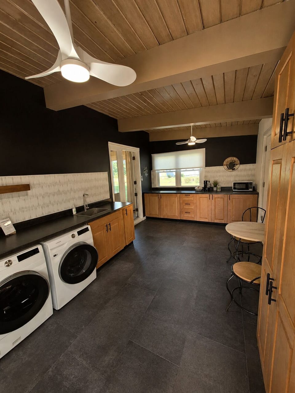 microwave, kitchen visible, indoor, kitchen, climate control, laundry coffee bar