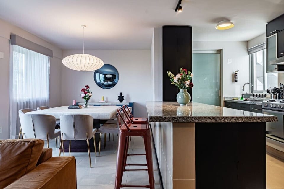 Gather for meals in this dining space, conveniently connected to the kitchen.