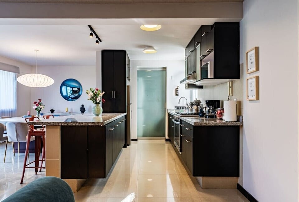 Cook and gather with ease in this sleek open kitchen.