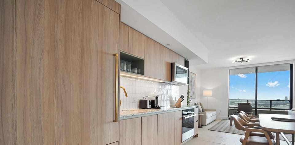 Fully equipped kitchen with ample storage and dining space.