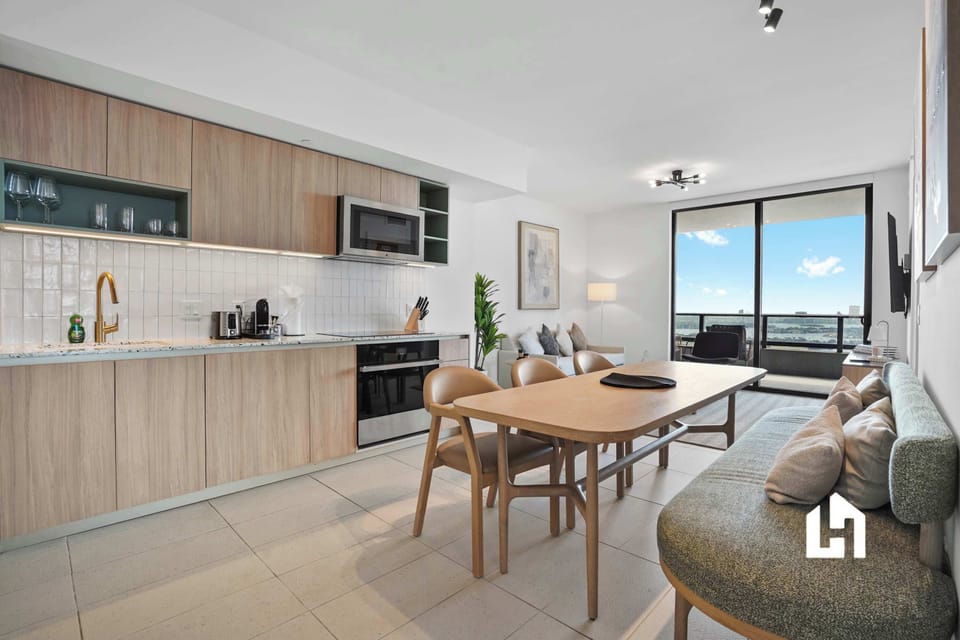 Open-concept kitchen, dining, and living area for gathering together.