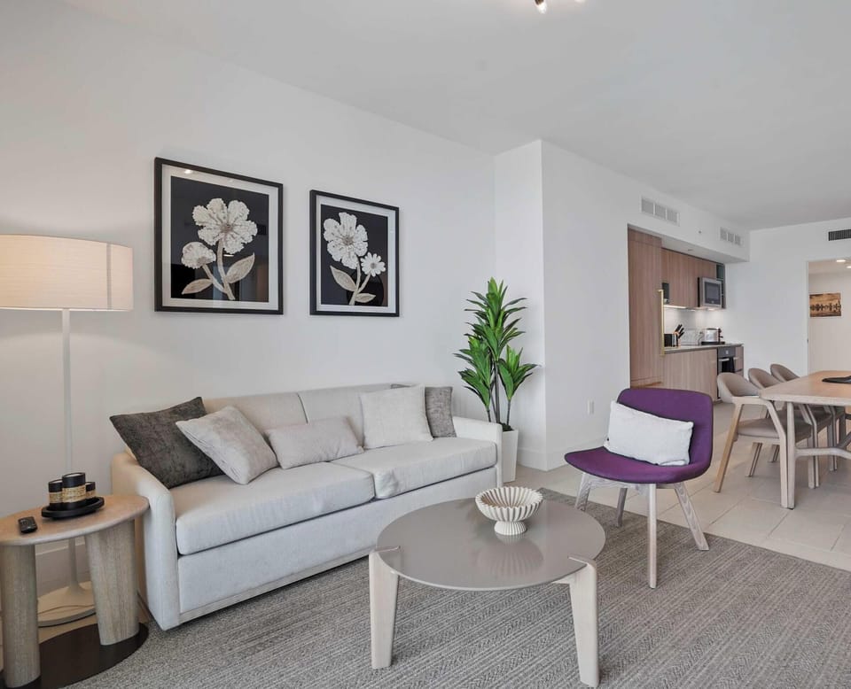 Open living room with a queen sofa bed and Smart TV.