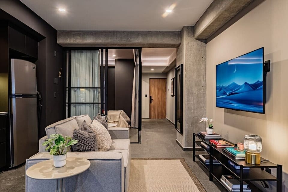 Comfortable living room with a Smart TV and convenient access to the bedroom.