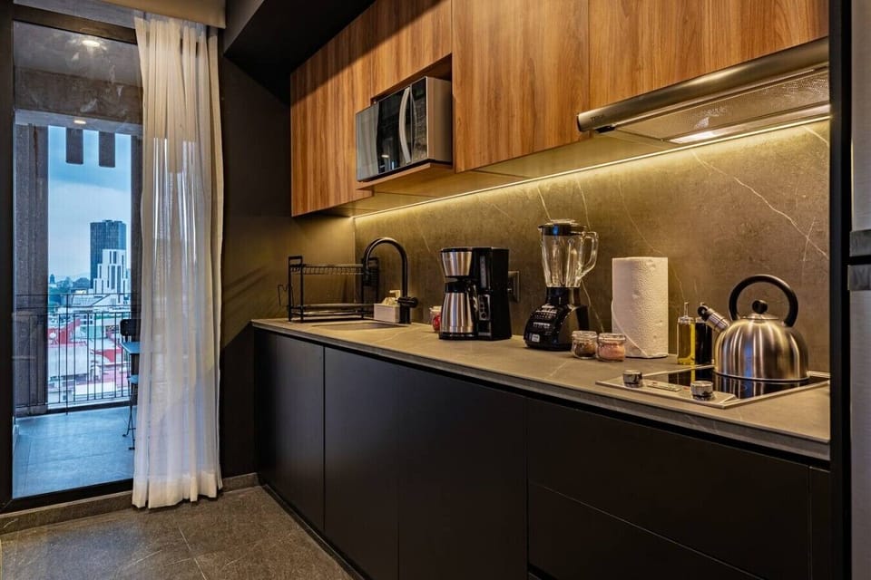 Sleek kitchen, fully equipped, perfect to prepare meals at home.
