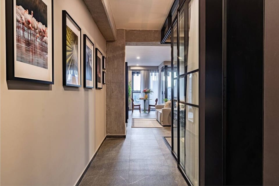 Sleek interior corridor connecting the bedroom and living area.