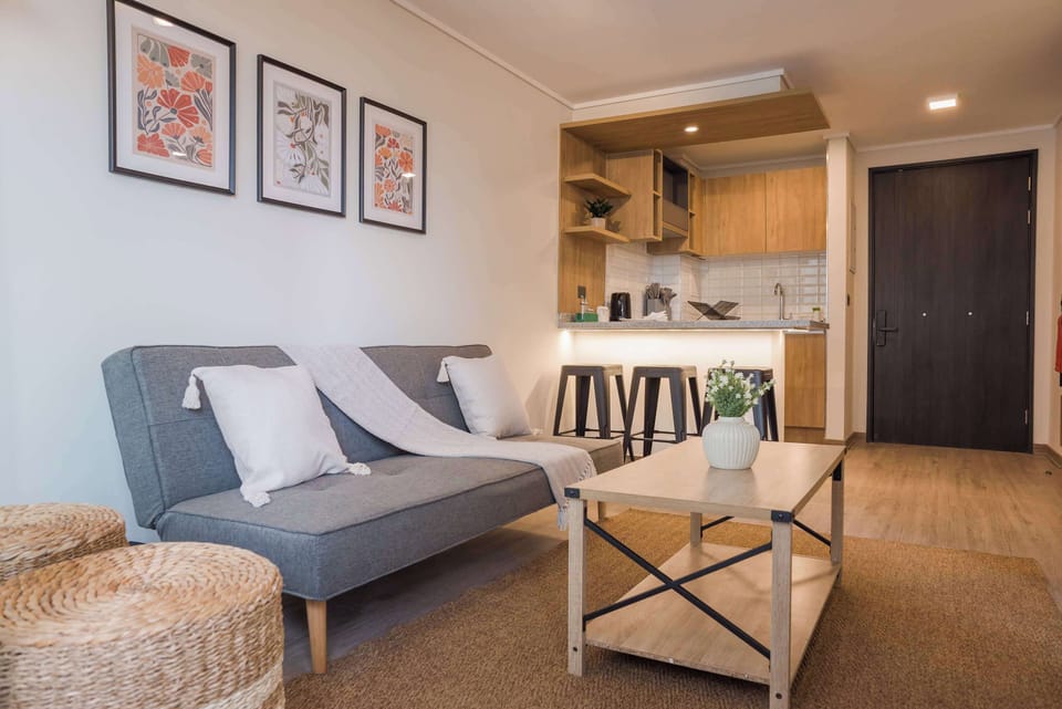 Charming studio with a cozy living area and modern kitchen, perfect for a relaxing stay in the heart of the city.