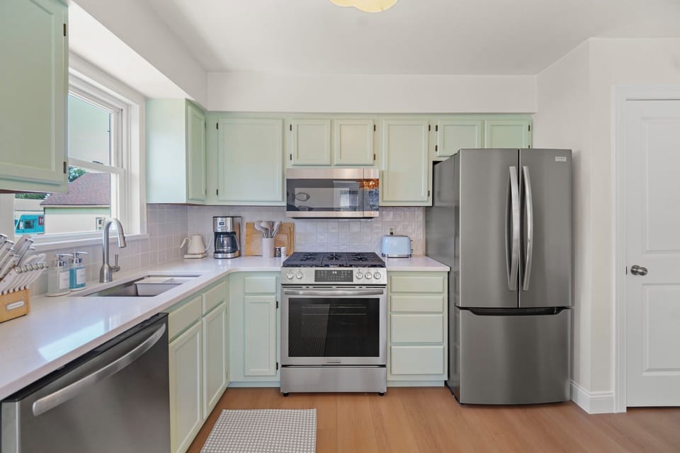 Cook with ease using new stainless appliances and a gas range.