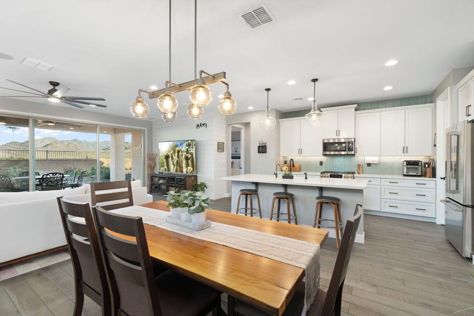  There are three barstools at the kitchen island.