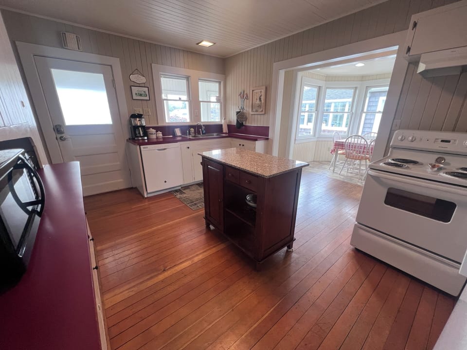Step into your charming kitchen and plenty of natural light streaming through the windows, perfect for preparing your morning coffee or planning your day's adventures.