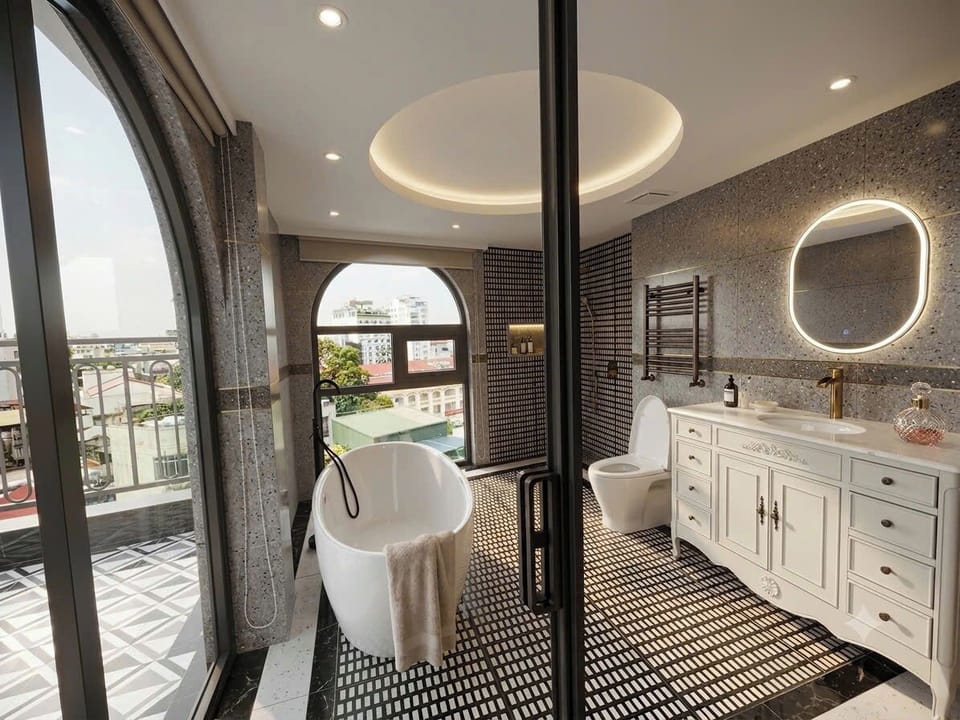 Luxury Suite, Balcony, City View | Bathroom | Separate tub and shower, hair dryer, towels, soap