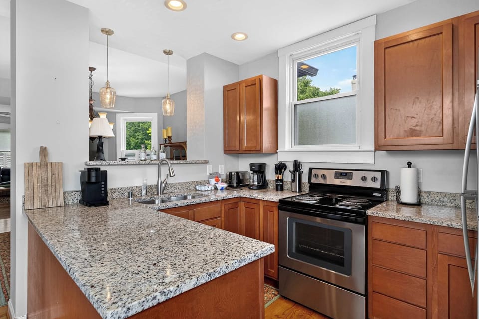 Kitchen: This bright, functional kitchen provides a comfortable space for brewing coffee, preparing meals, and keeping everyone fueled throughout the stay.