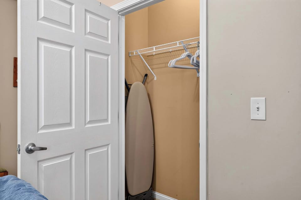 Bedroom 2: Settle into a bright and inviting bedroom with plush bedding and a relaxing atmosphere that makes it easy to unwind after a busy day.