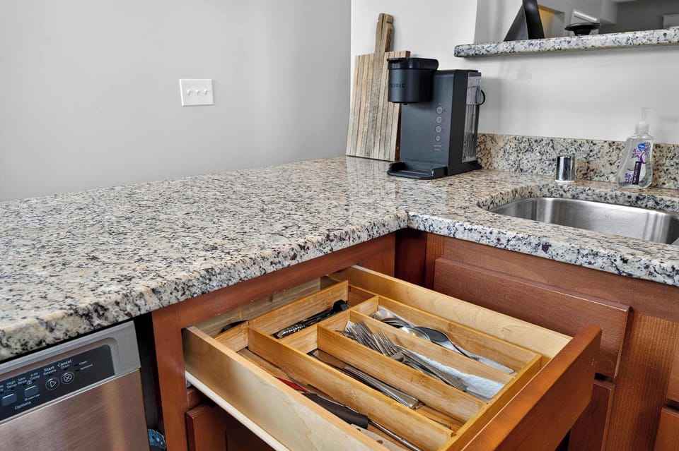 Kitchen: This bright, functional kitchen provides a comfortable space for brewing coffee, preparing meals, and keeping everyone fueled throughout the stay.