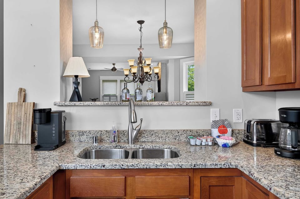 Kitchen: This bright, functional kitchen provides a comfortable space for brewing coffee, preparing meals, and keeping everyone fueled throughout the stay.