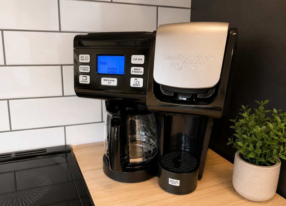 Kitchen: Gather in a bright kitchen and dining area with modern appliances, ample counter space, and a comfortable table for sharing meals, coffee, and conversation.
