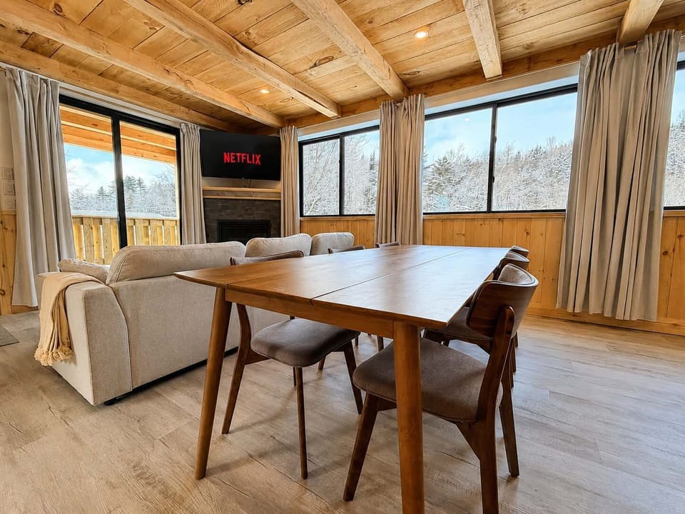 Dining Area: Gather in a bright kitchen and dining area with modern appliances, ample counter space, and a comfortable table for sharing meals, coffee, and conversation.