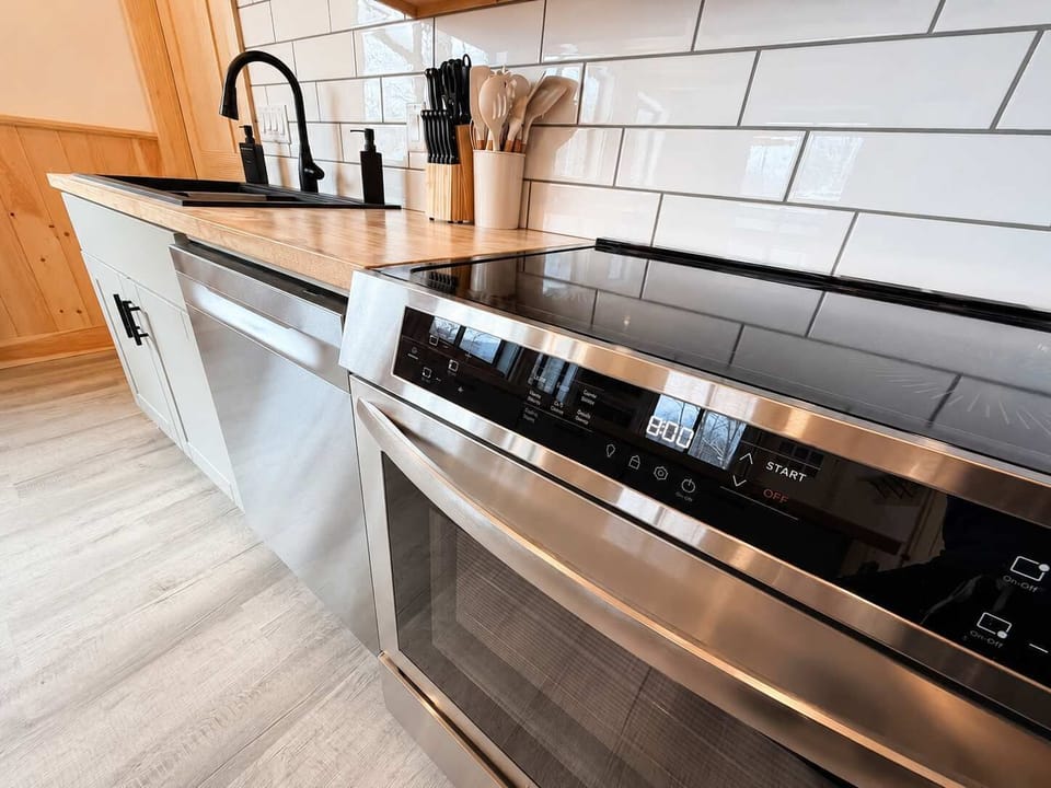 Kitchen: Enjoy a bright, well-equipped kitchen beside a welcoming dining area, making it easy to prepare meals, share breakfast, or gather for relaxed dinners during your stay.