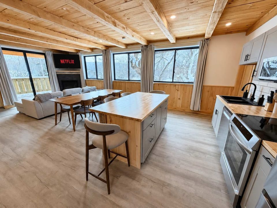 Dining Area: Enjoy a bright, well-equipped kitchen beside a welcoming dining area, making it easy to prepare meals, share breakfast, or gather for relaxed dinners during your stay.