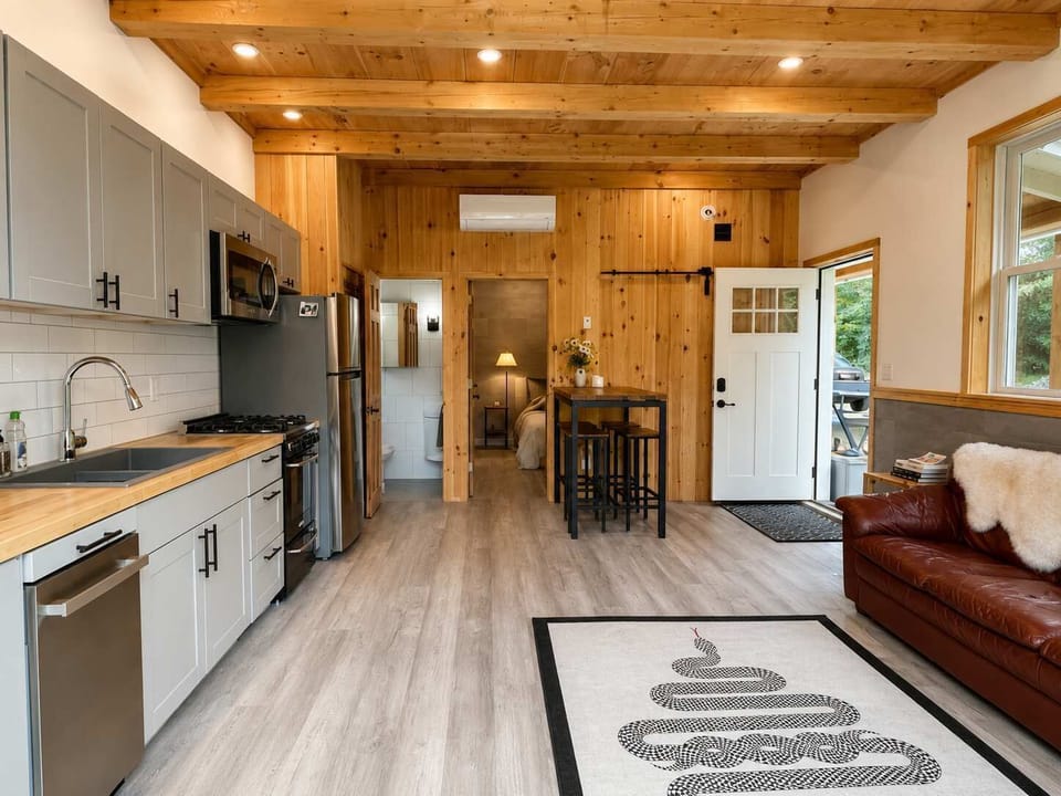 Living Area: Relax in a cozy open-concept living room that flows seamlessly into the kitchen, creating a welcoming space for lounging, dining, and spending quality time together.