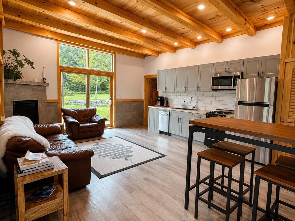 Living Area: Relax in a cozy open-concept living room that flows seamlessly into the kitchen, creating a welcoming space for lounging, dining, and spending quality time together.