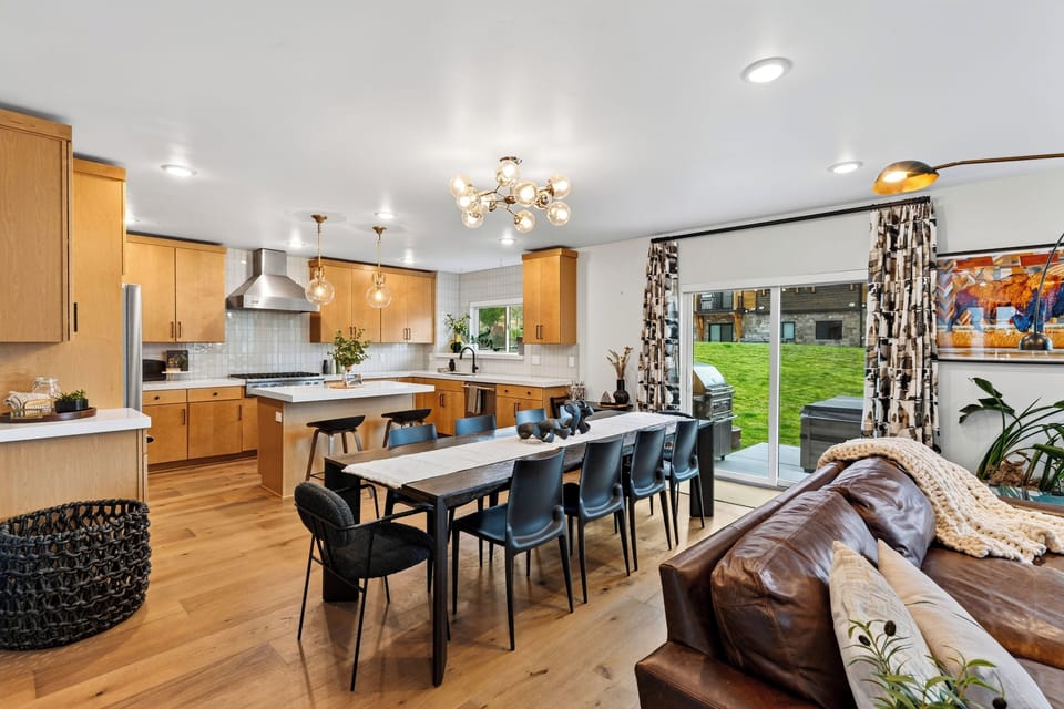 Bright kitchen and dining area opening up to outdoor patio access.