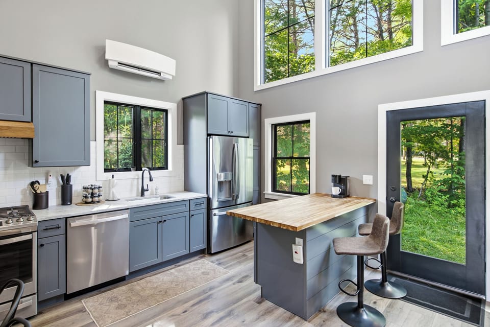 A modern kitchen with generous workspace makes preparing meals simple and convenient.