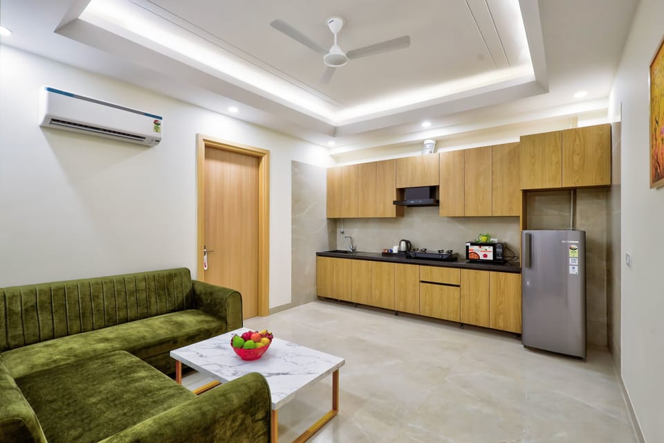 Studio Suite | Living area | 54-inch LED TV with digital channels, printers