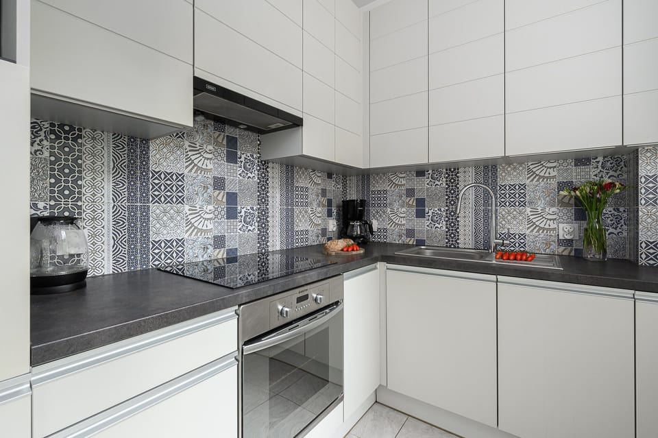 Classic Apartment, Balcony, City View | Private kitchen | Electric kettle, griddle, eco-friendly cleaning products, spices