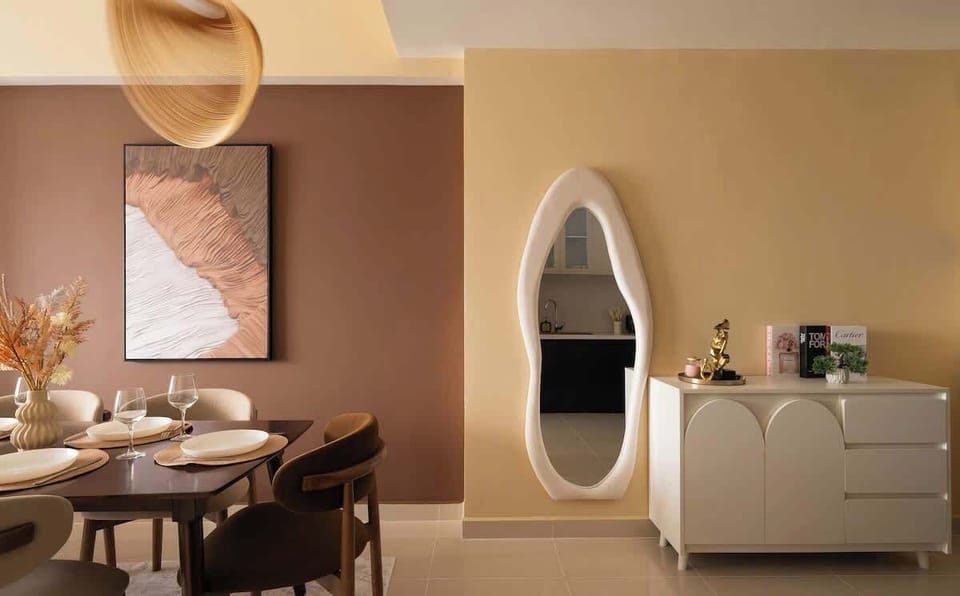 Design-forward entry with sculptural full-length mirror, minimalist console, and curated decor. Includes guest slippers, stylish books, and ambient lighting. A chic welcome moment that sets the tone for your stay and perfect for selfies.