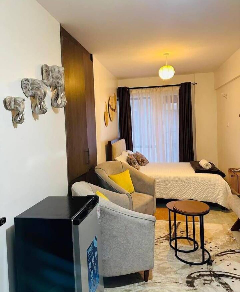 Deluxe Studio, City View | Living area | 32-inch Smart TV with digital channels