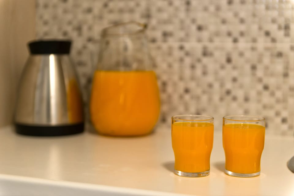 Fridge, espresso maker, electric kettle, cleaning supplies