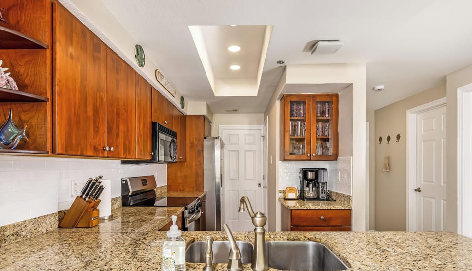 Full kitchen with granite countertops, stainless appliances, and plenty of space for meal preparation for the whole family