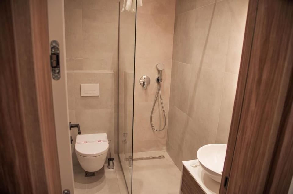 Standard Double Room, City View | Bathroom | Free toiletries, hair dryer, slippers, towels