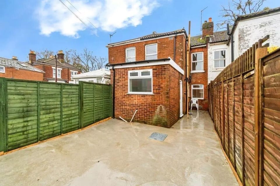 Private paved rear yard, a quiet spot to step outside and unwind.