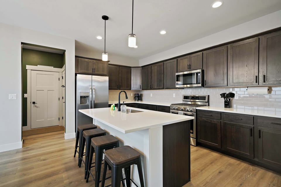 Kitchen: Prepare meals with ease in this well-equipped kitchen, featuring ample counter space and everything needed for morning coffee, quick snacks, or home-cooked dinners.