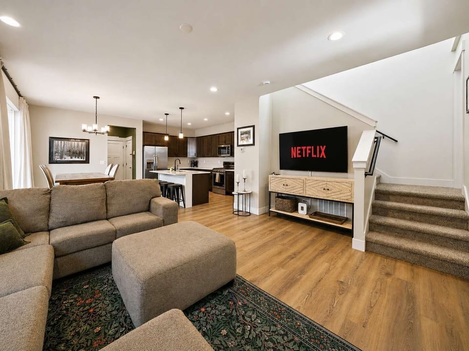 Living Room: Settle into a warm and inviting living room with plush seating, soft lighting, and a comfortable layout designed for relaxing, reading, or enjoying a quiet evening.