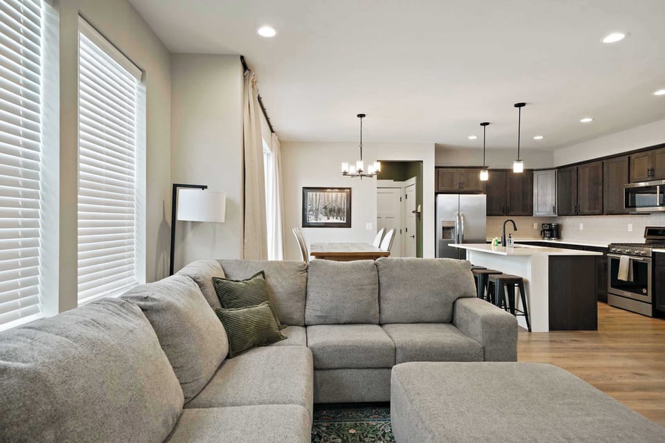 Living Room: Settle into a warm and inviting living room with plush seating, soft lighting, and a comfortable layout designed for relaxing, reading, or enjoying a quiet evening.